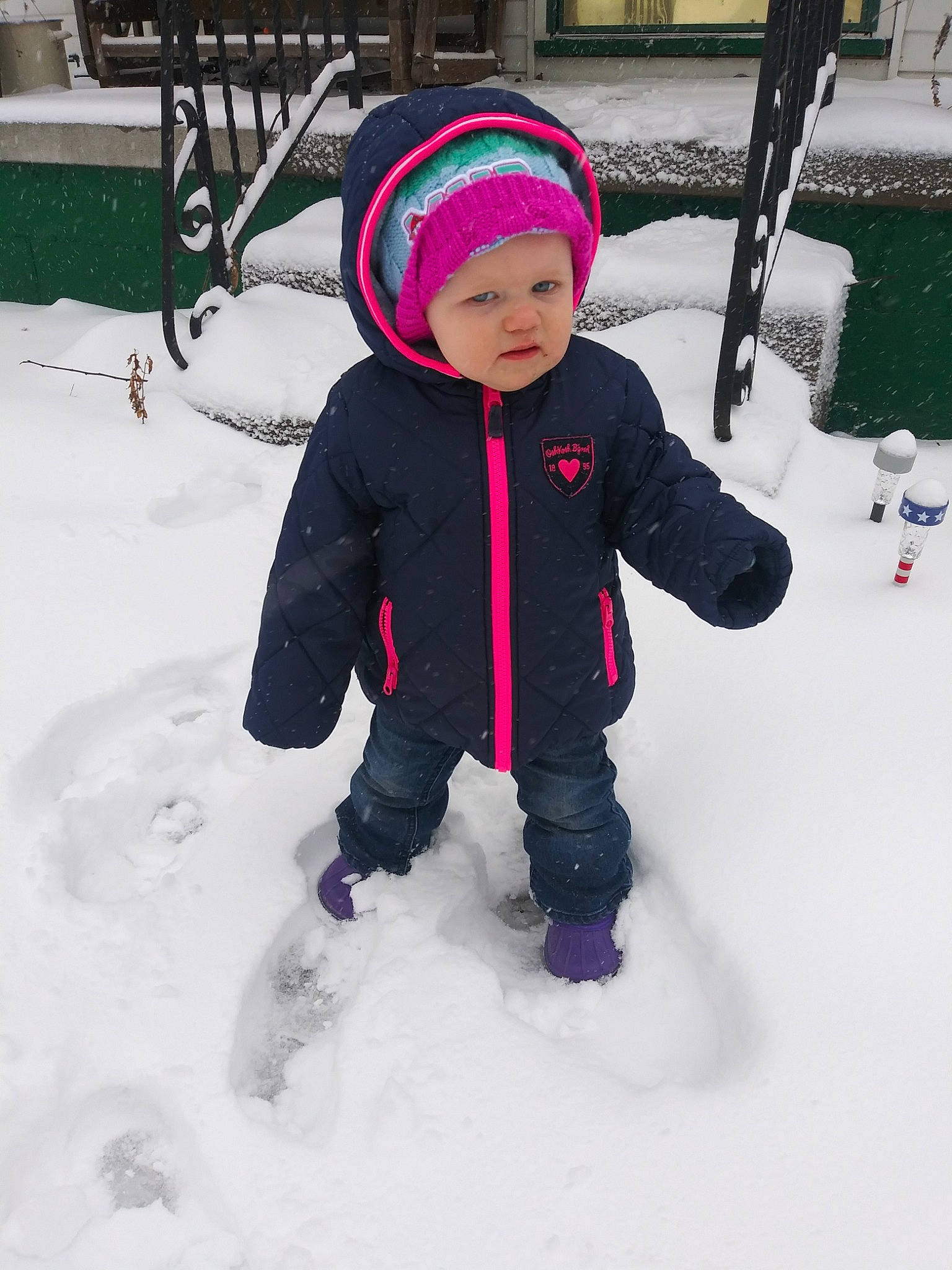 Molly joined the competition — help win amazing prizes! bonnet, child, freezing, fun, leisure, outerwear, person, pink, play, playing_in_the_snow, precipitation, smile, snow, toddler, vacation, winter, winter_storm