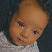 Henry joined the competition — help win amazing prizes! baby, child, face, portrait, closeup, eyes, expression, skin, hair, clothing, infant, young, person, head, cute, looking, indoors, neutral_expression, soft_light, gray_shirt