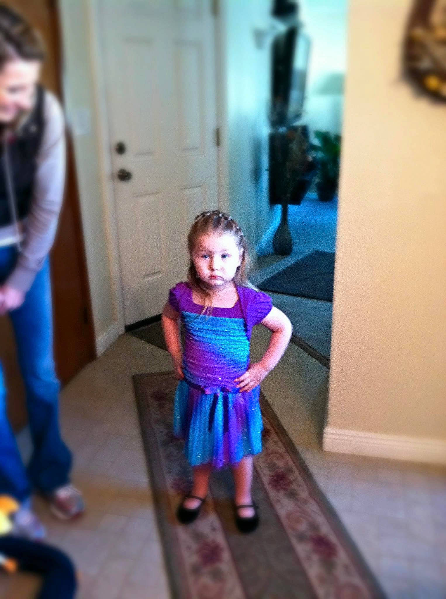 Beyonce is registered to the contest to win money with this photo: baby_toddler_clothing, blurred, child, door, electric_blue, event, fashion_design, floor, flooring, fun, happy, joint, leisure, magenta, person, pink, purple, room, sandal, standing