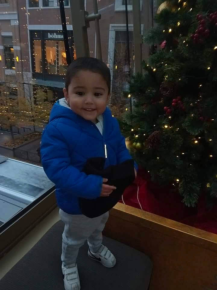 Aaron joined the competition — help win amazing prizes! baby_toddler_clothing, beauty, christmas_ornament, christmas_tree, electric_blue, evergreen, eye, face, facial_expression, fun, happy, head, holiday_ornament, jacket, joy, ornament, person, sleeve, smile, standing