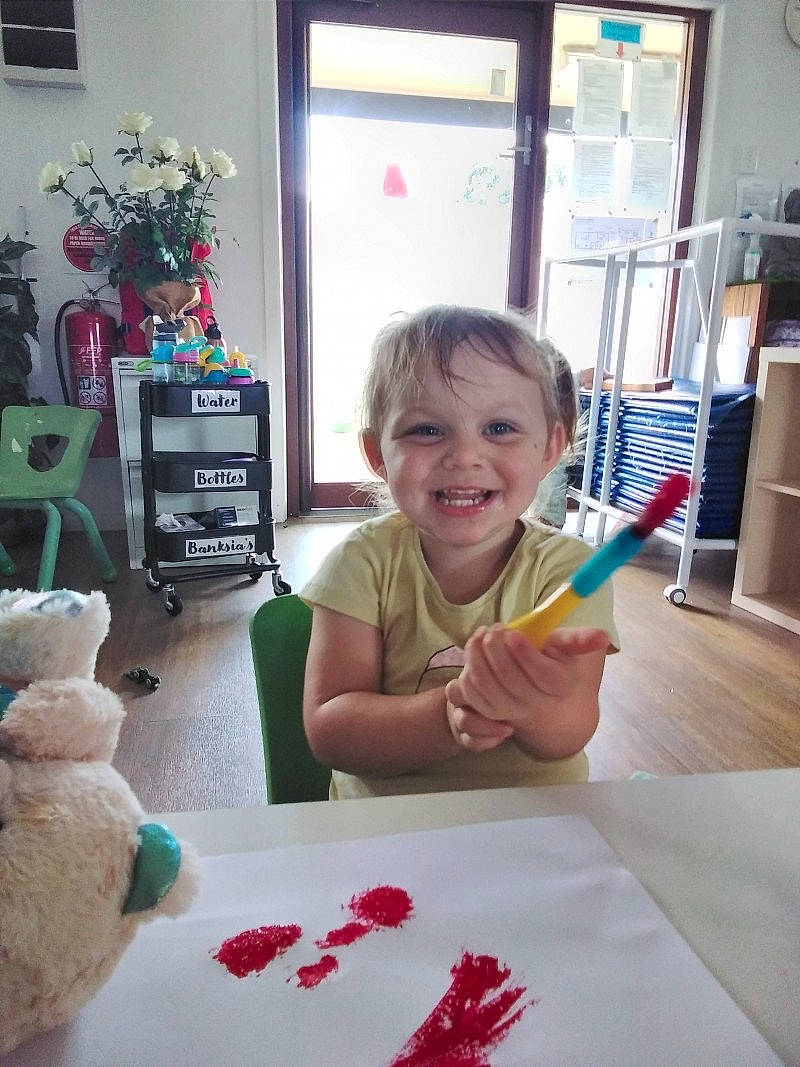 Kalina-rose is registered to the contest to win money with this photo: carmine, chair, child, comfort_food, event, finger, flooring, flowerpot, fun, houseplant, joy, nail, person, plant, play, room, smile, t_shirt, table, tableware