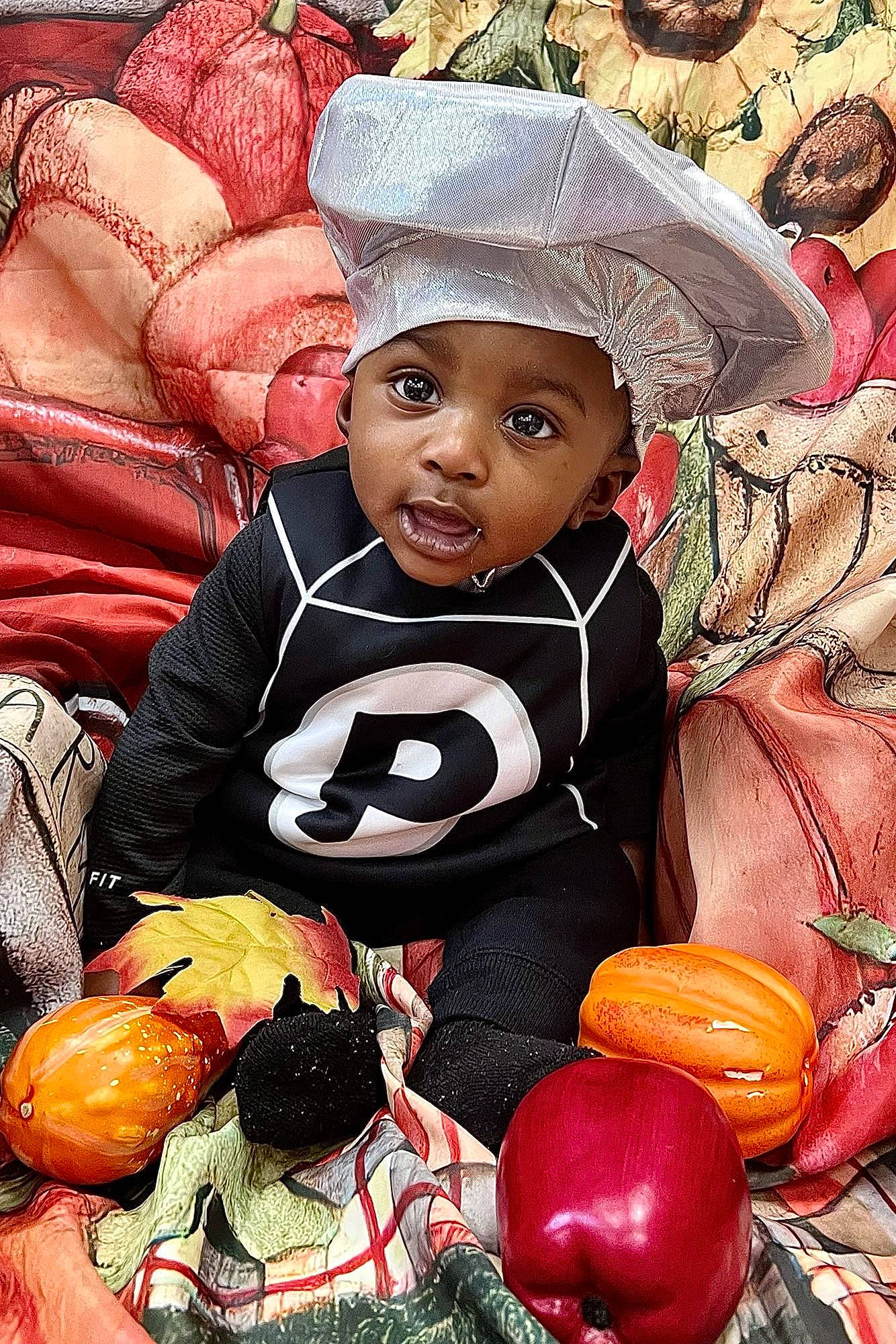 Josiah joined the competition — help win amazing prizes! art, baby, baby_toddler_clothing, calabaza, child, cucurbita, event, facial_expression, fun, gourd, happy, headgear, headwear, orange, organ, person, pumpkin, toddler, tradition, trick_or_treat