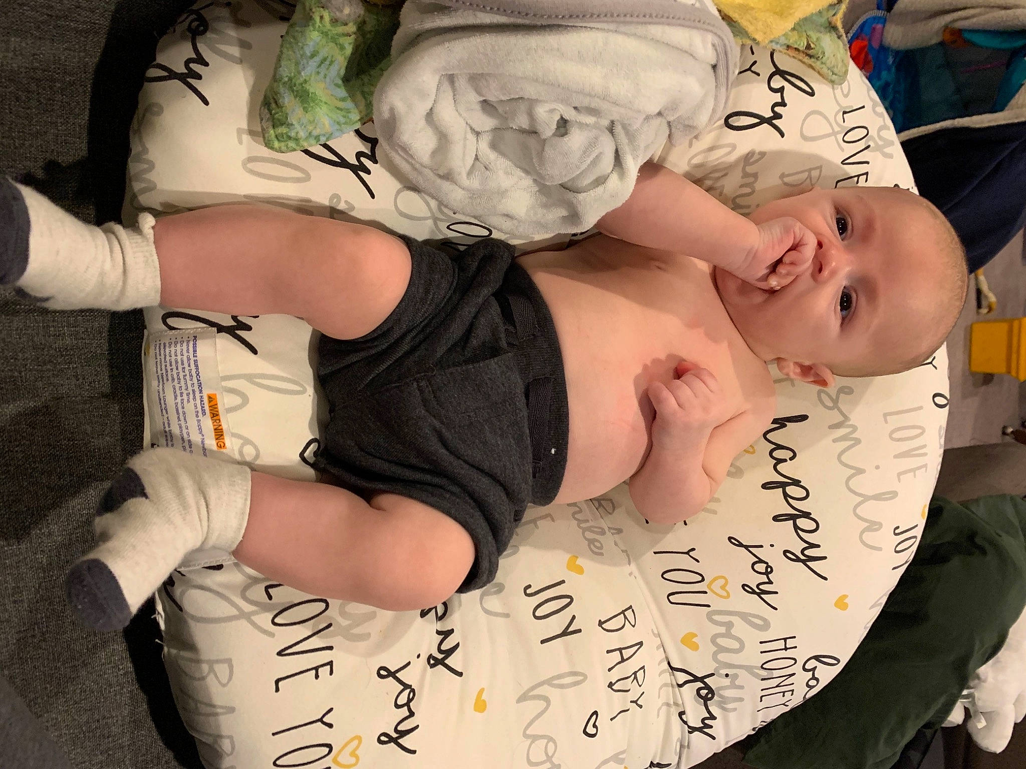 Anduin is registered to the contest to win money with this photo: abdomen, baby, baby_toddler_clothing, chest, child, comfort, elbow, finger, font, fun, gesture, hand, handwriting, happy, human_leg, mouth, person, sleeve, thigh, toddler