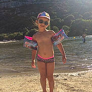 Léana participe au concours pour gagner de l'argent avec cette photo : abdomen, beach, fun, girl, headgear, leisure, recreation, sand, sea, shorts, summer, sun_tanning, swimwear, tourism, undergarment, vacation, water