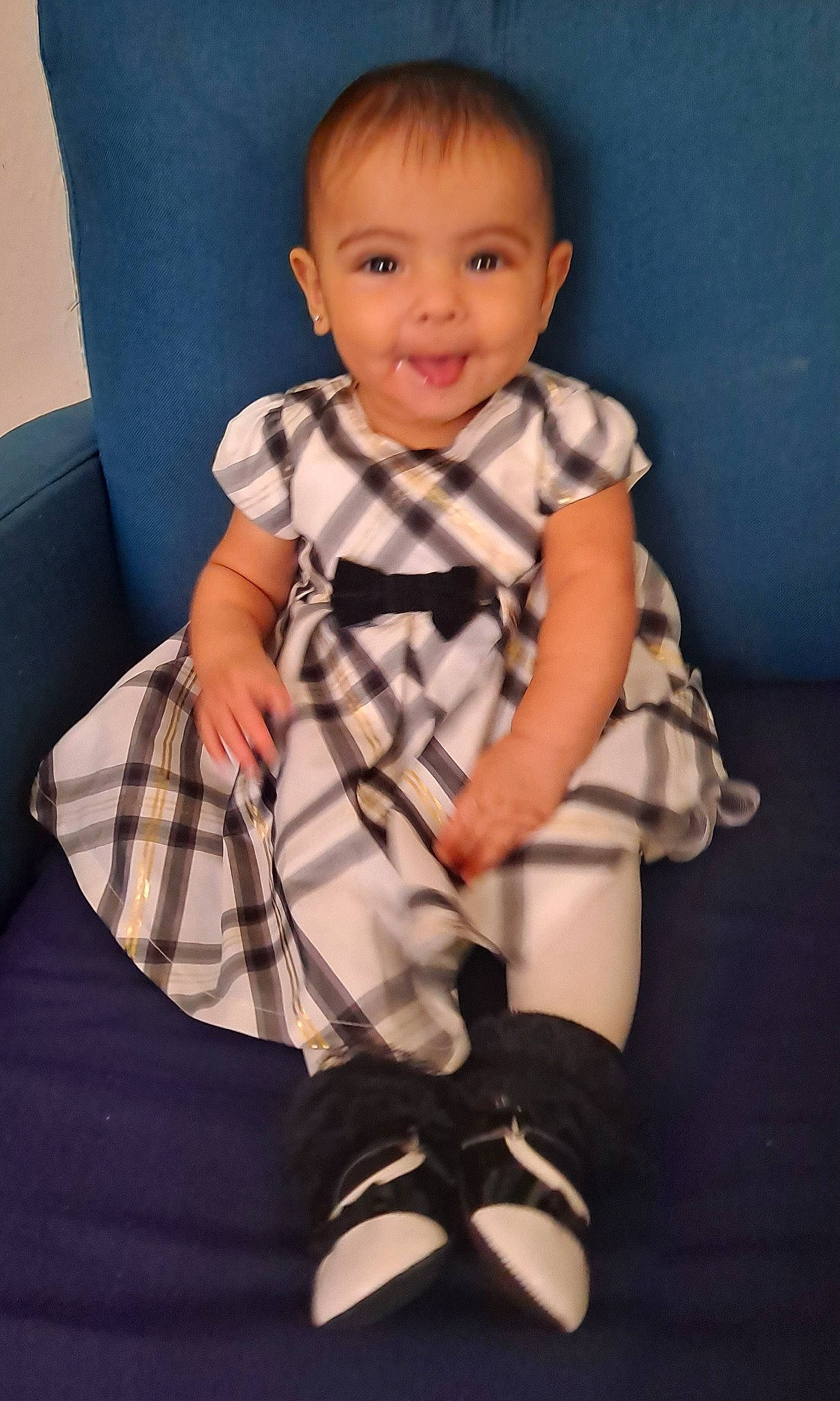 Ysabella is registered to the contest to win money with this photo: baby, baby_toddler_clothing, child, comfort, face, facial_expression, hairstyle, happy, human_body, human_leg, joy, knee, leg, pattern, person, purple, skin, sleeve, smile, sock