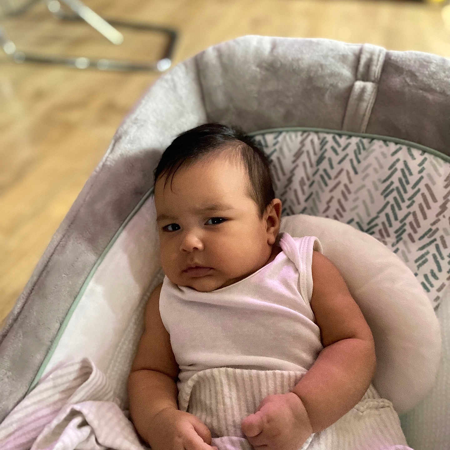 Lilibeth is registered to the contest to win money with this photo: arm, baby, blanket, child, clothing, cushion, expression, face, floor, furniture, hand, indoor, infant, person, portrait, resting, seat, skin, soft, wooden_floor