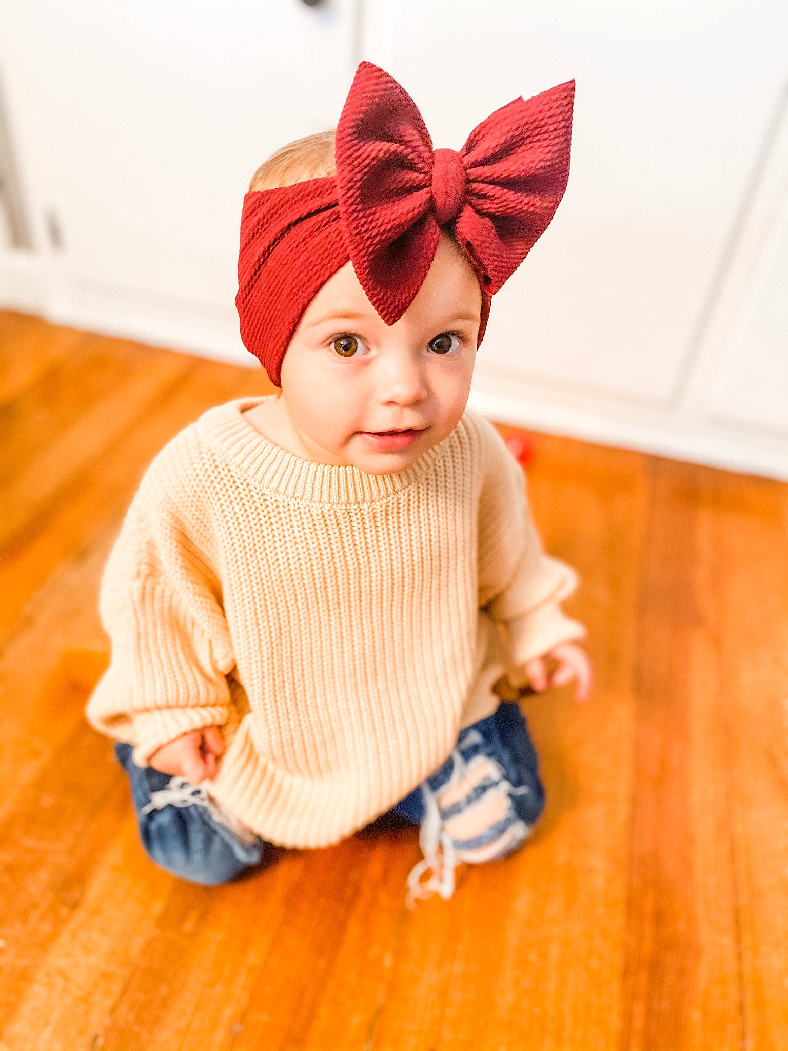 Roni is registered to the contest to win money with this photo: baby, beanie, cap, child, clothing, ear, fashion_accessory, fur, head, headgear, headwear, knit_cap, neck, organ, outerwear, pattern, person, skin, sleeve, toddler