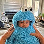 baby, child, costume, blue, fluffy, hood, eyes, hands, indoor, living_room, furniture, window, door, person, cute, soft, plush, expression, home, cozy