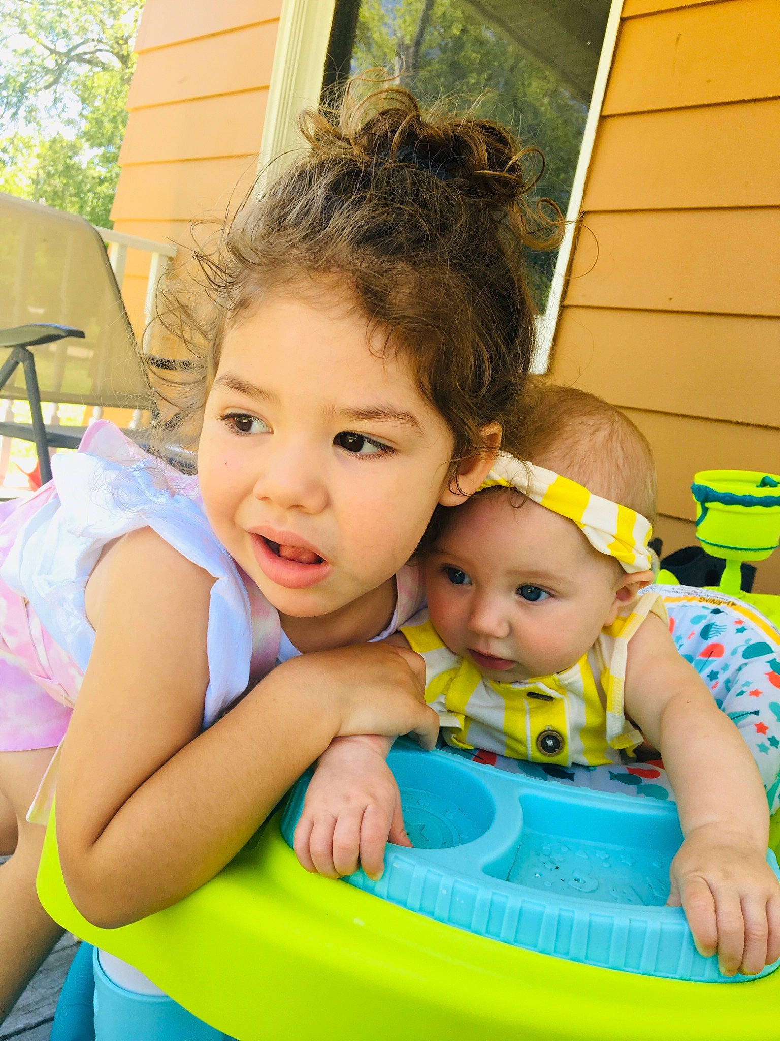 Celine is registered to the contest to win money with this photo: baby, baby_products, baby_toddler_clothing, child, event, eye, fun, grass, hairstyle, happy, iris, leisure, person, play, recreation, sharing, sitting, skin, snapshot, toddler