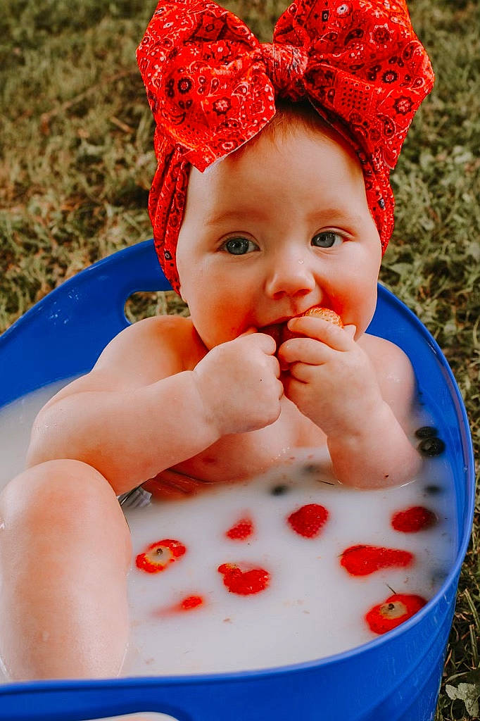 Lyla joined the competition — help win amazing prizes! arm, baby, baby_toddler_clothing, cap, face, finger, fun, grass, hand, happy, hat, leisure, lip, mouth, person, pink, recreation, red, skin, sweetness