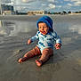 baby, beach, water, sand, sun_hat, smile, child, reflection, outdoor, swimsuit, happy, sky, clouds, legs, feet, sunlight, summer, fun, play, vacation