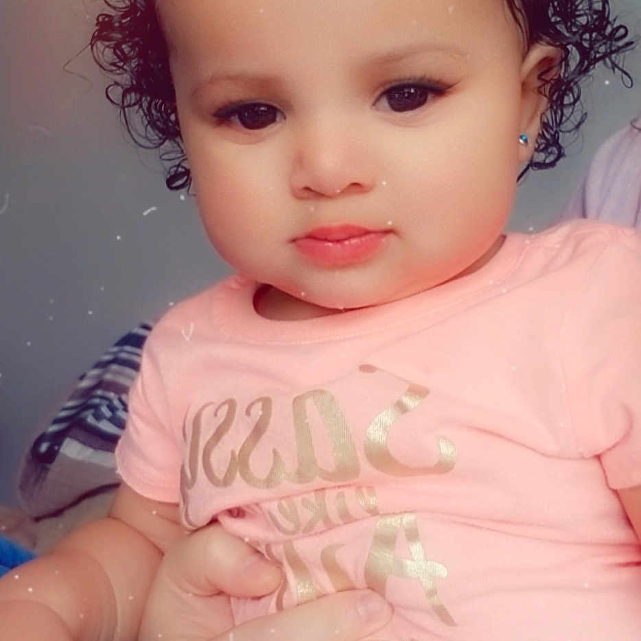 Ayanna is registered to the contest to win money with this photo: baby, beauty, brown_hair, cheek, child, child_model, chin, eye, eyebrow, face, forehead, hair, head, iris, lip, mouth, nose, person, pink, skin