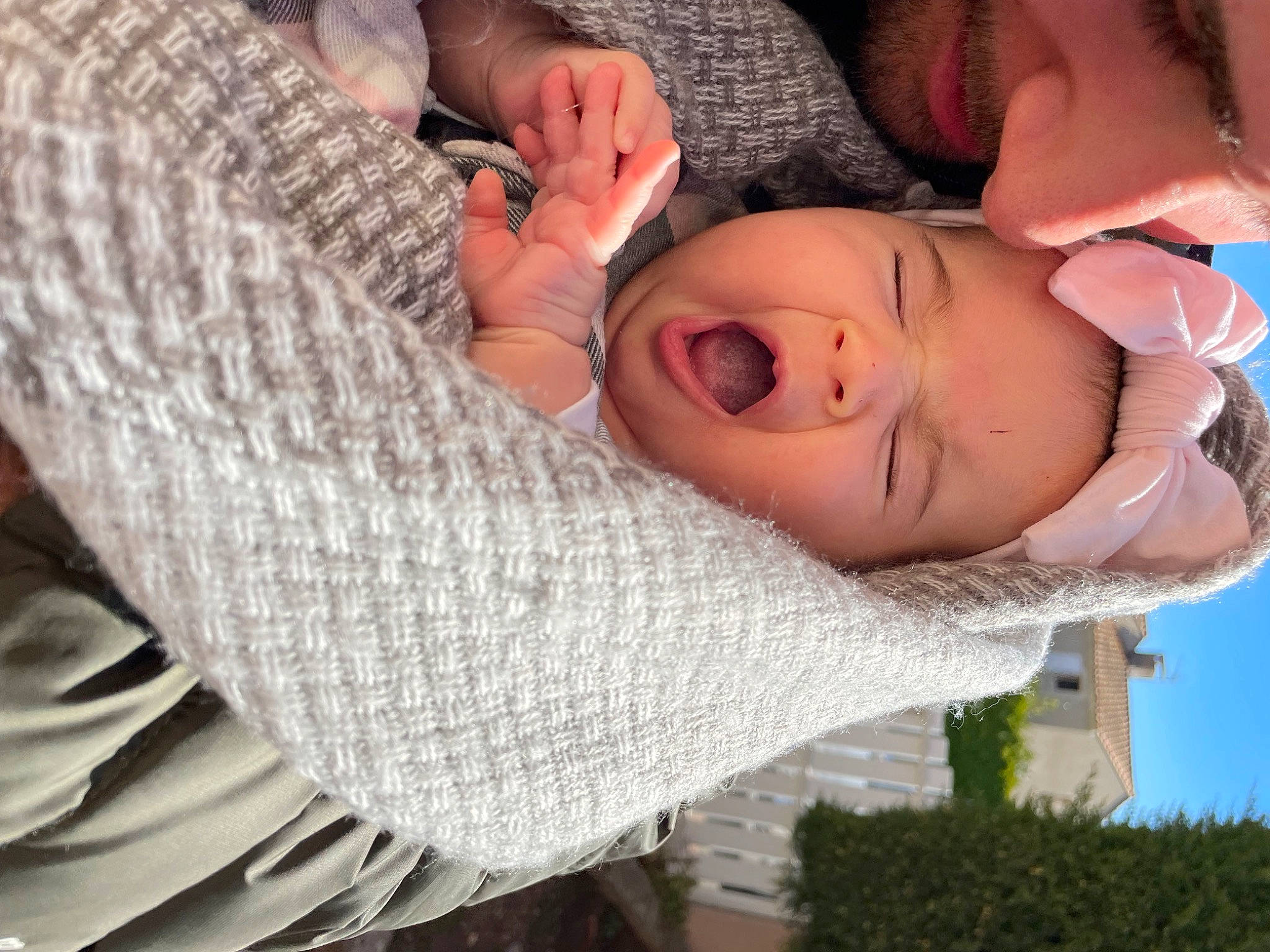 Ella participe au concours pour gagner de l'argent avec cette photo : baby, baby_toddler_clothing, child, comfort, finger, fun, gesture, grass, happy, knitting, pattern, person, plant, sitting, sky, sleeve, toddler, tree, wool, woolen