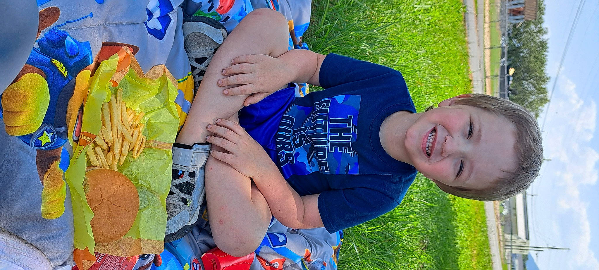 Brenner is registered to the contest to win money with this photo: azure, blue, child, electric_blue, finger, fun, grass, grass_family, green, happy, hat, human_body, joy, leisure, people_in_nature, person, plant, shorts, smile, summer