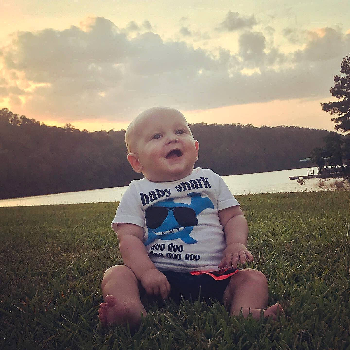 Baker is registered to the contest to win money with this photo: beauty, child, cloud, cool, facial_expression, grass, green, head, light, morning, people_in_nature, person, photograph, sitting, skin, sky, snapshot, standing, summer, sunlight