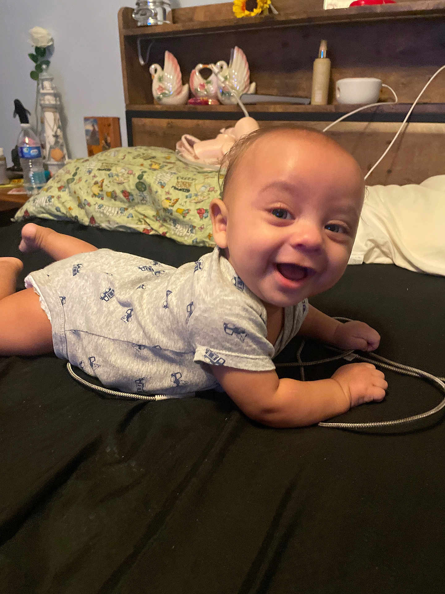 Tiberias joined the competition — help win amazing prizes! baby, smiling, bed, pillow, toy, furniture, indoors, person, happy, face, infant, clothing, head, skin, hand, foot, decor, room, lying_down, cute
