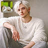 young_man, platinum_blond_hair, white_sweater, casual_pose, portrait, indoor, cat, fluffy_cat, white_cat, lounging_cat, green_background, inset_photo, facial_hair, necklace, light_skin, relaxed, fashion, modern, soft_lighting, artistic