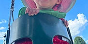 Memphis joined the competition — help win amazing prizes! baby, blue_sky, child, clouds, daytime, fun, greenery, hand, happy, legs, metal_chain, outdoor, park, play_equipment, playground, polka_dot, red_clothing, smiling, sunhat, swing