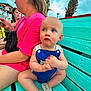 Phoenix joined the competition — help win amazing prizes! baby, child, woman, bench, outdoor, turquoise, pink_shirt, palm_tree, cloudy_sky, shoes, blue_eyes, wooden_bench, people, summer, casual_clothing, daylight, portrait, sitting, curious, background