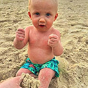 Phoenix is registered to the contest to win money with this photo: child, baby, sand, beach, sunset, water, ocean, shorts, blue_eyes, bare_chest, summer, vacation, nature, outdoor, play, hands, skin, portrait, sand_on_skin, sunlight