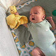 Anthony is registered to the contest to win money with this photo: baby, baby_clothing, baby_sock, blanket, child, crib, cute, happy, indoors, infant, lying_down, mesh_crib, newborn, onesie, patterned_blanket, plush_toy, smiling, soft_lighting, toy, winnie_the_pooh