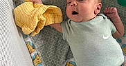 Anthony is registered to the contest to win money with this photo: baby, baby_clothing, baby_sock, blanket, child, crib, cute, happy, indoors, infant, lying_down, mesh_crib, newborn, onesie, patterned_blanket, plush_toy, smiling, soft_lighting, toy, winnie_the_pooh