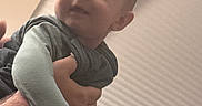 Abbott joined the competition — help win amazing prizes! baby, background, blinds, candid, child, clothing, cozy, curious, expression, eyes, face, hand, holding, indoor, infant, light, person, portrait, soft, warm