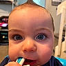 Camron is registered to the contest to win money with this photo: baby, child, close_up, face, blue_eyes, hair, toothbrush, hands, indoor, curious, cute, infant, portrait, skin, expression, chewing, young, person, childhood, playful