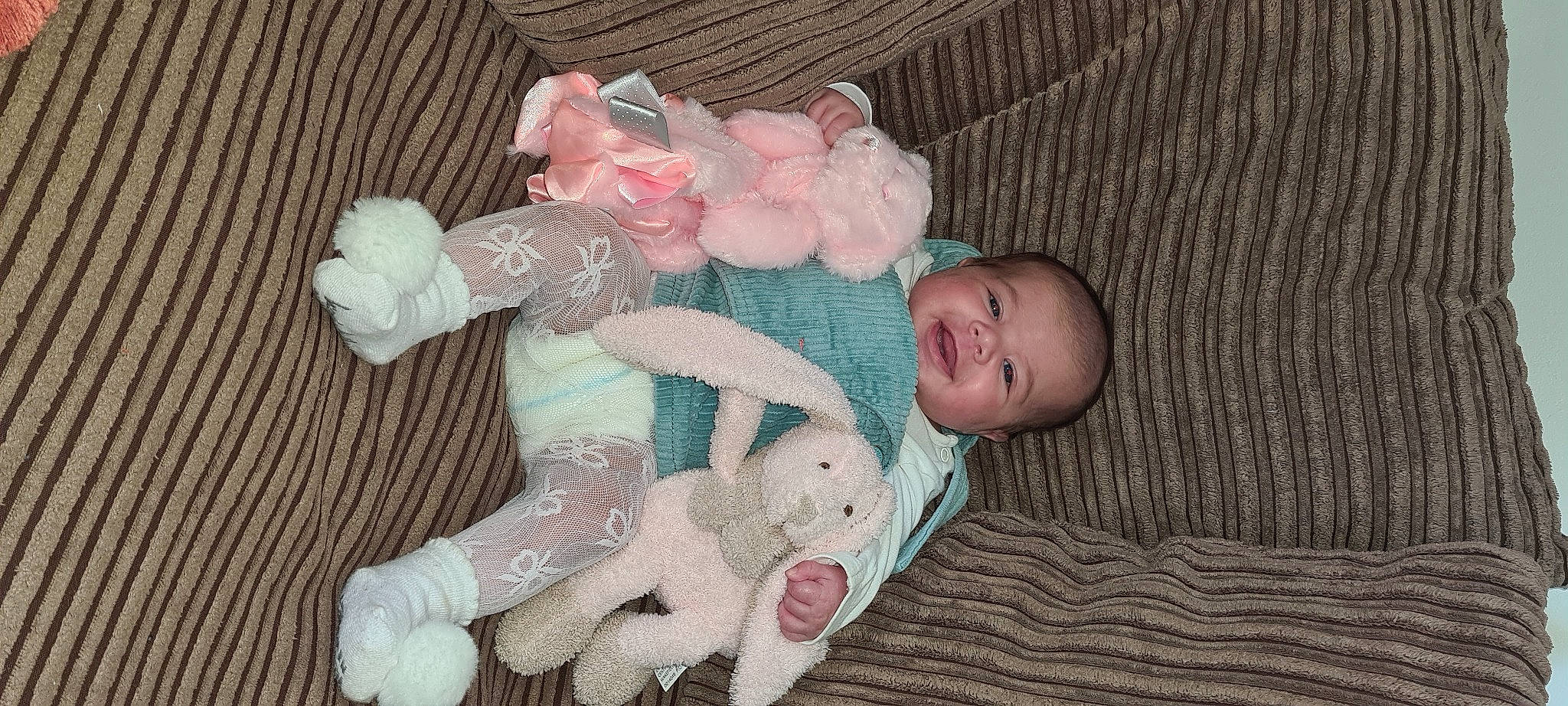 Cienna is registered to the contest to win money with this photo: baby, baby_products, baby_toddler_clothing, cheek, child, comfort, eye, finger, hand, head, headgear, human_body, iris, person, pink, product, skin, textile, toddler, toy