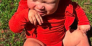 Sage joined the competition — help win amazing prizes! baby, child, grass, outdoor, sunlight, red_clothing, pigtails, cute, smiling, barefoot, infant, nature, happy, sitting, skin, young_child, daylight, playful, portrait, closeup