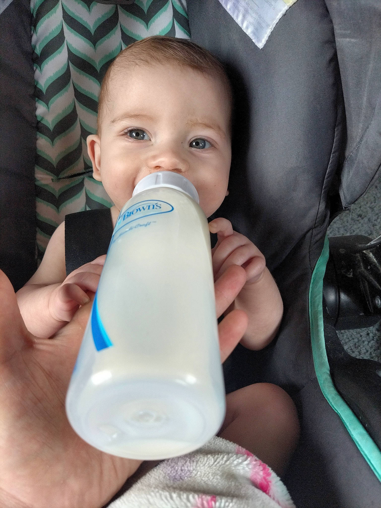 Kiara is registered to the contest to win money with this photo: baby, baby_bottle, baby_products, bottle, child, comfort, drinkware, finger, hand, health_care, human_body, liquid, milk, nail, person, plant_milk, plastic, plastic_bottle, skin, thumb