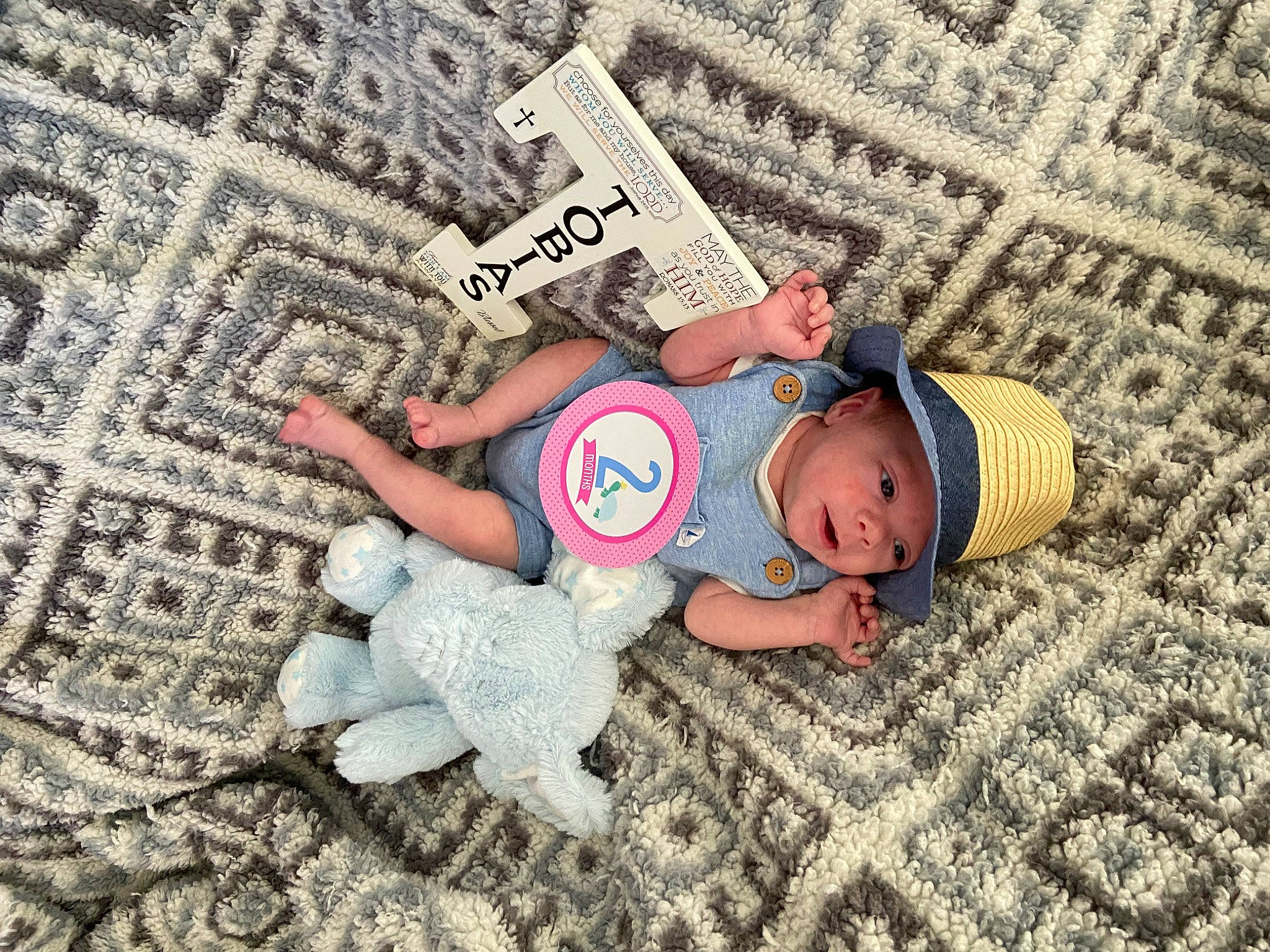 Tobias joined the competition — help win amazing prizes! baby, baby_products, baby_toddler_clothing, carpet, child, comfort, floor, flooring, font, fun, grass, happy, headgear, headwear, linens, pattern, person, skin, t_shirt, textile