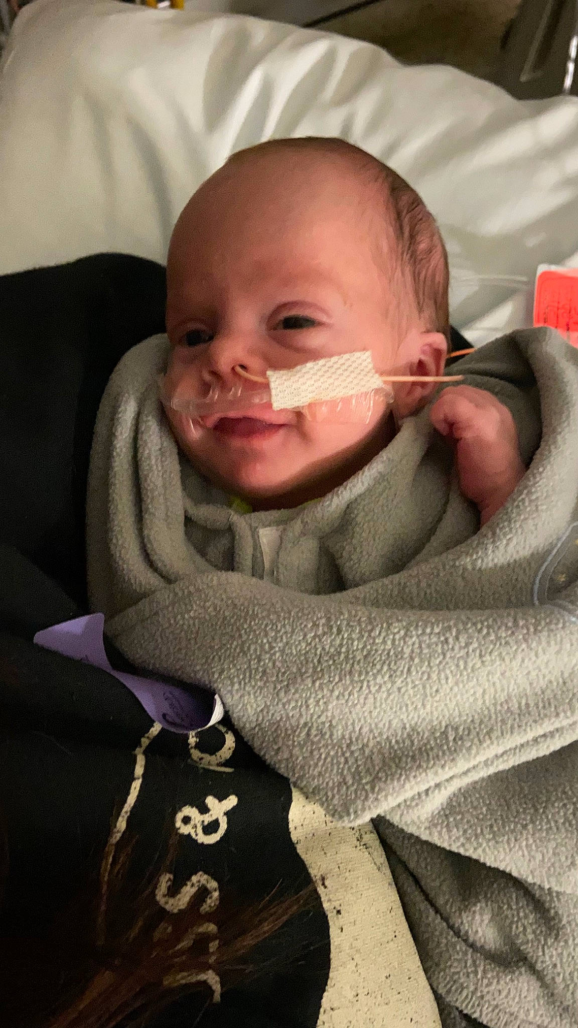 Tobias is registered to the contest to win money with this photo: baby_toddler_clothing, cheek, collar, comfort, ear, eyebrow, eyelash, finger, gesture, happy, jaw, lip, mouth, neck, nose, outerwear, person, seat_belt, skin, sleeve