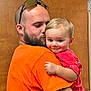 Monty joined the competition — help win amazing prizes! man, child, toddler, beard, orange_shirt, red_shirt, tattoo, hug, smile, affection, indoor, door, glasses, short_hair, holding, cute, family, love, portrait, people