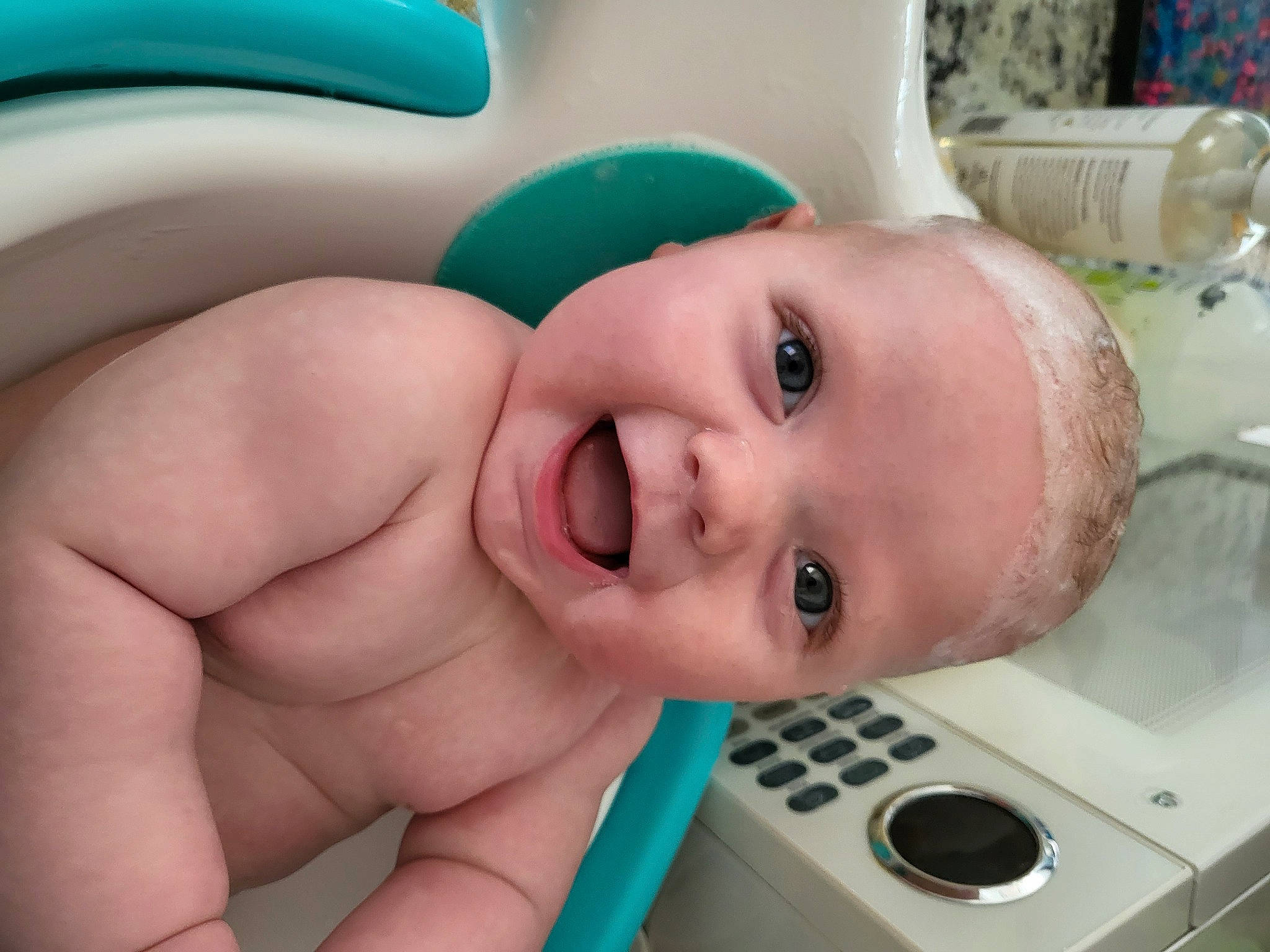Charlie is registered to the contest to win money with this photo: baby, bathing, cheek, chest, ear, eye, eyebrow, eyelash, face, finger, head, iris, lip, mouth, nose, organ, person, skin, smile, toddler