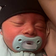Rj joined the competition — help win amazing prizes! newborn, baby, pacifier, sleeping, hat, onesie, infant, closeup, face, peaceful, resting, cute, cozy, skin, person, headwear, child, indoors, portrait, soft