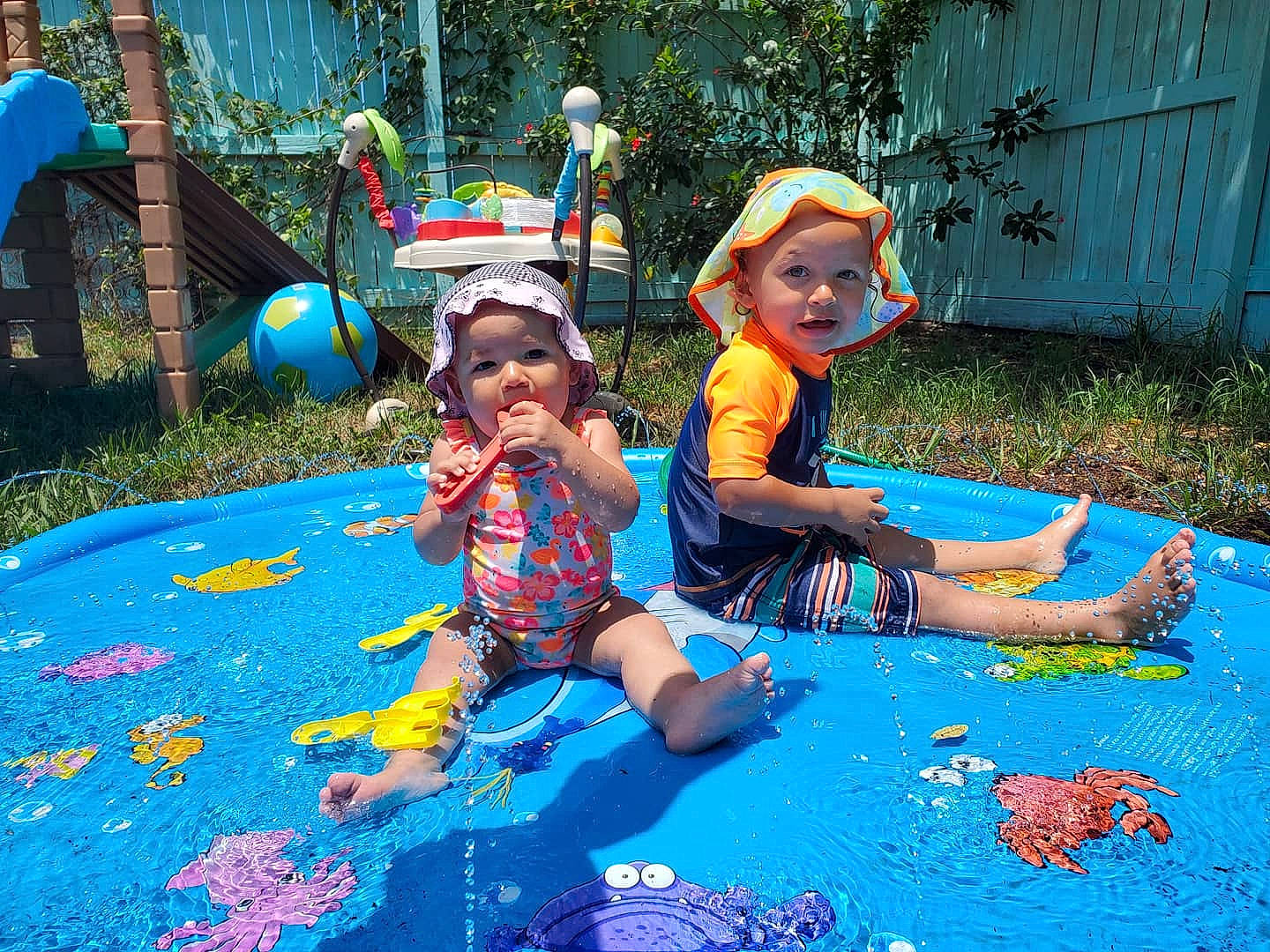 Zuko is registered to the contest to win money with this photo: art, baby, blue, child, electric_blue, event, fun, grass, green, headwear, human_settlement, leisure, nature, person, personal_protective_equipment, plant, play, recreation, summer, toddler