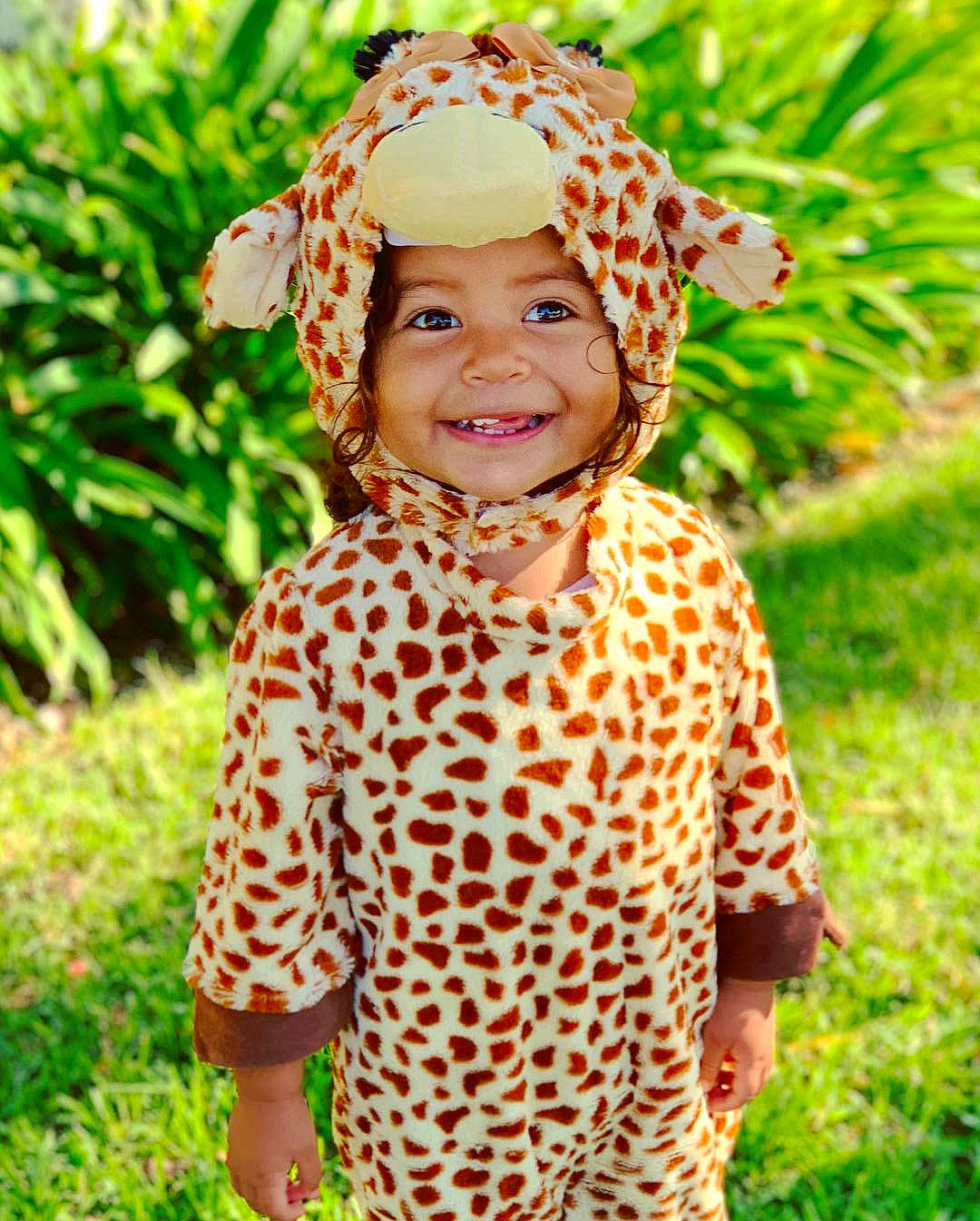 Symphony joined the competition — help win amazing prizes! child, giraffe, giraffidae, girl, grass, hair_accessory, happiness, headgear, headwear, infant, joy, mammal, pattern, person, smile, toddler