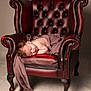 Lilith joined the competition — help win amazing prizes! baby, newborn, sleeping, armchair, leather, red, cloth, draped, wooden_floor, indoors, furniture, cozy, portrait, peaceful, child, infant, soft_lighting, vintage, brown, relaxation