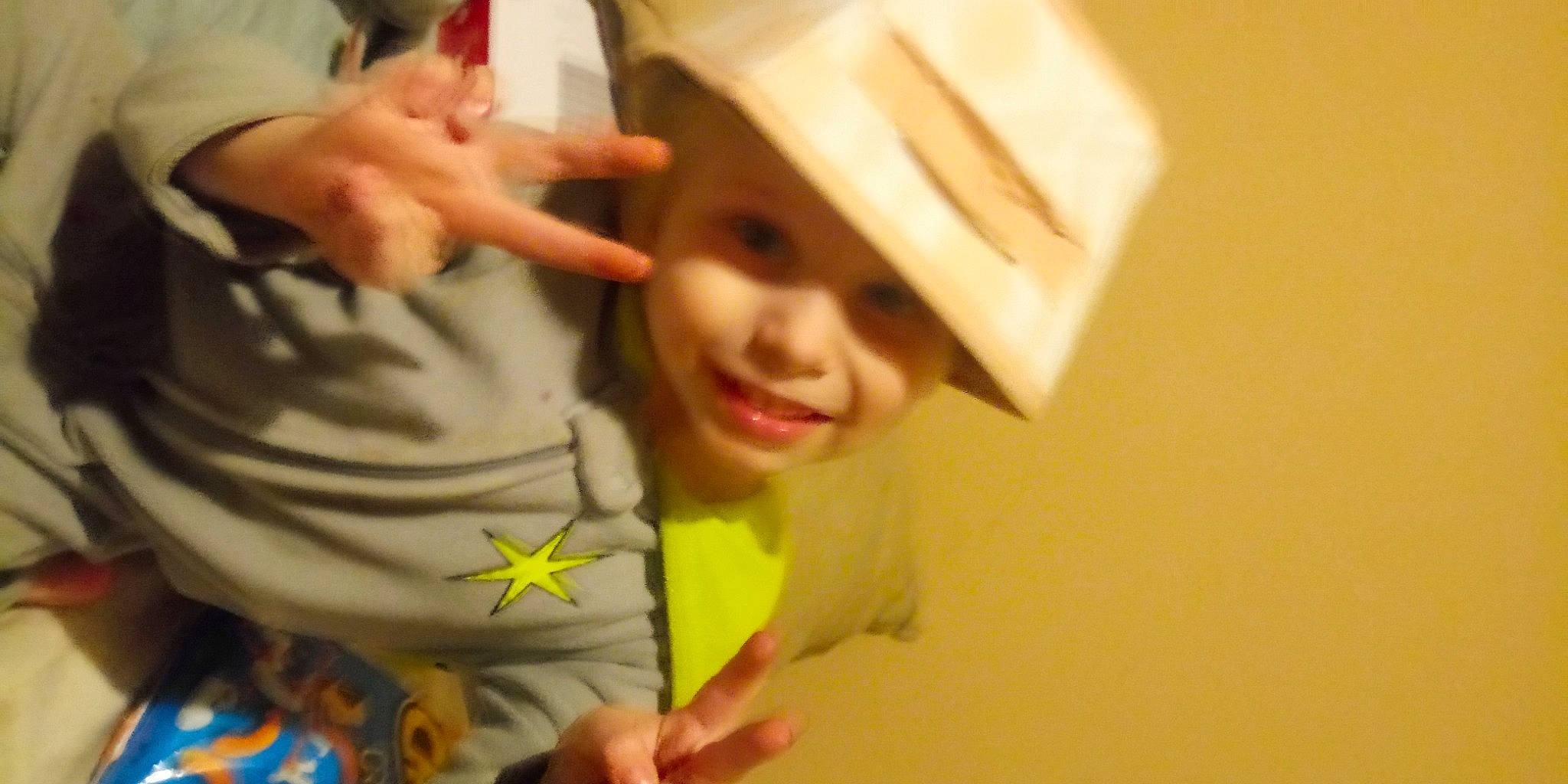 Jaxsyn is registered to the contest to win money with this photo: baby, baby_toddler_clothing, child, facial_expression, finger, gesture, happy, headwear, home_accessories, human, joy, laugh, nail, person, product, skin, thumb, toddler