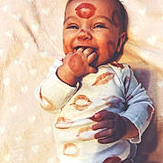 Savannah joined the competition — help win amazing prizes! baby, infant, smiling, face, hand, blanket, onesie, lipstick, kiss_marks, bow, cute, happy, lying_down, fingers_in_mouth, soft_texture, heart_pattern, clothing, portrait, child, indoors