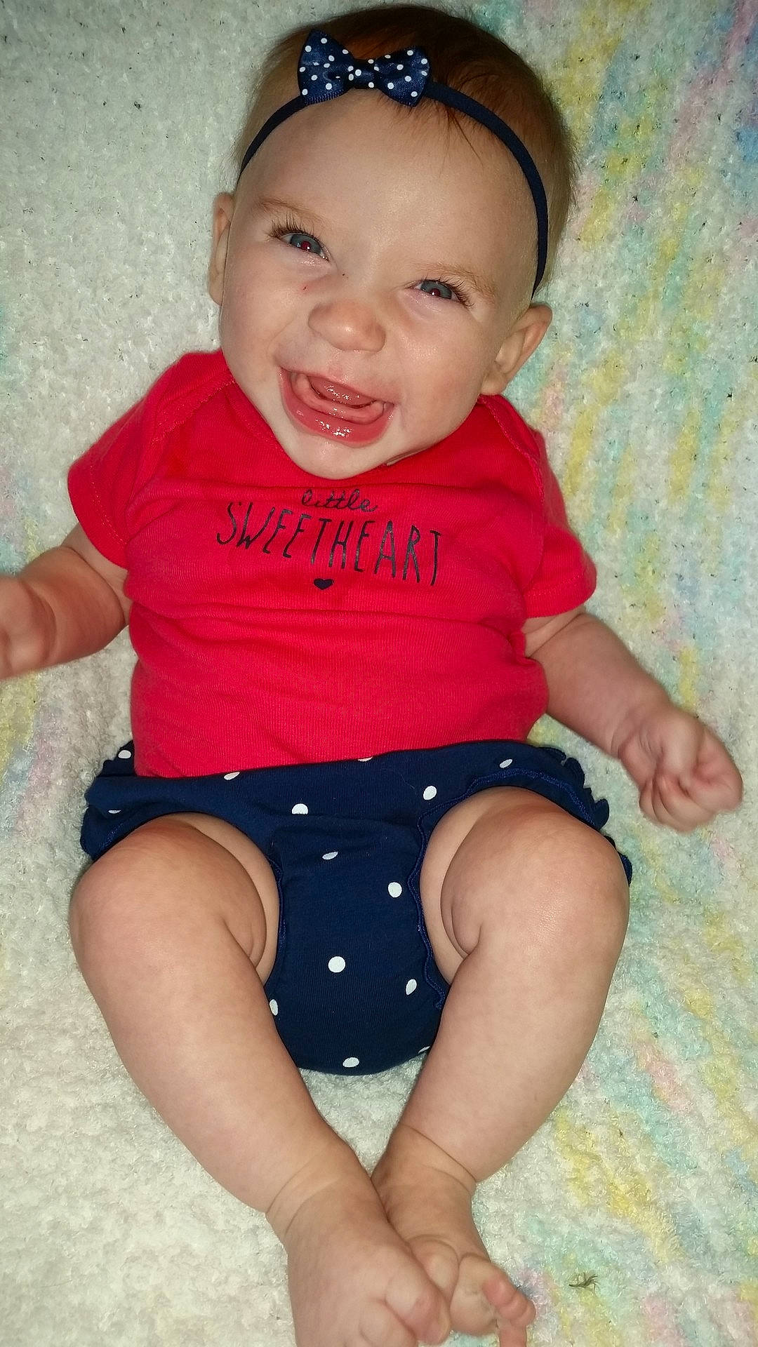 Aislynn is registered to the contest to win money with this photo: abdomen, arm, cheek, child, day, finger, girl, hand, headgear, infant, joint, joy, leg, mouth, sitting, skin, smile, standing, thigh, toddler