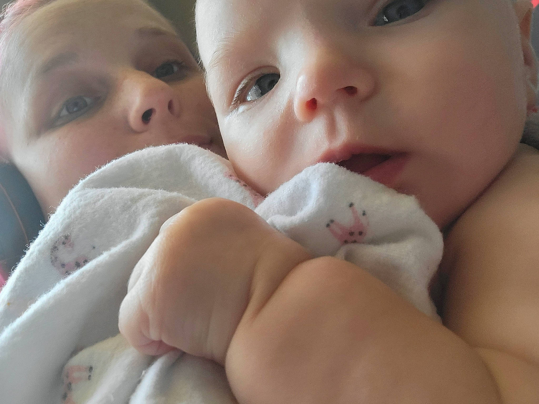 Amelia is registered to the contest to win money with this photo: cheek, chin, drinkware, eye, eyebrow, eyelash, facial_expression, finger, forehead, gesture, happy, iris, lip, mouth, nose, person, pink, skin, textile, toddler