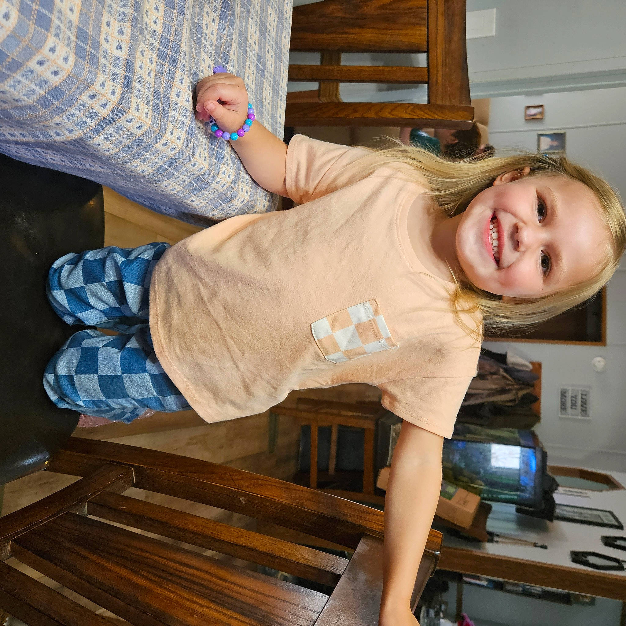 Arya is registered to the contest to win money with this photo: cabinetry, countertop, elbow, flooring, hardwood, home_appliance, homemaker, human_leg, joint, joy, kitchen, kitchen_appliance, knee, person, room, sleeve, smile, t_shirt, thigh, waist