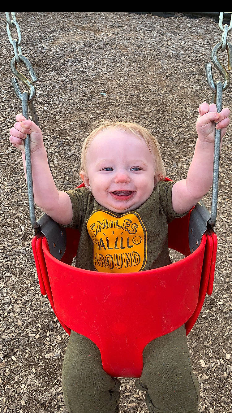 Ryan joined the competition — help win amazing prizes! child, fun, joy, outdoor_play_equipment, person, play, playground, public_space, recreation, smile, swing, toddler