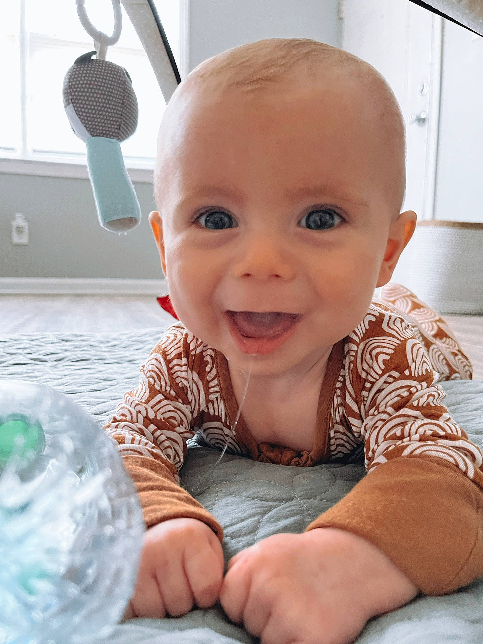 Draven is registered to the contest to win money with this photo: arm, baby, baby_toddler_clothing, cheek, comfort, eye, face, gesture, hairstyle, hand, happy, head, iris, nose, person, product, skin, sleeve, smile, standing