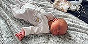 Ivy joined the competition — help win amazing prizes! newborn, baby, sleeping, onesie, blanket, soft, cozy, infant, child, rest, peaceful, cute, hand, face, bedroom, fabric, texture, clothing, nap, indoors