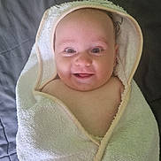 Myla participe au concours pour gagner de l'argent avec cette photo : baby, smiling, towel, hooded_towel, wrapped, infant, cute, happy, face, skin, child, portrait, blanket, indoors, person, head, expression, newborn, comfort, resting