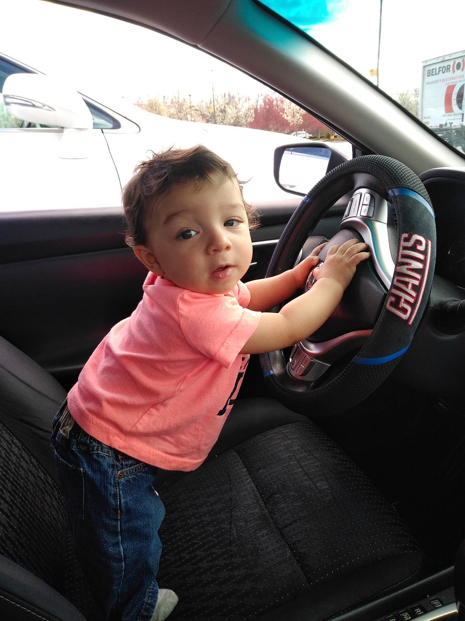 John joined the competition — help win amazing prizes! auto_part, automotive_design, car, car_seat, car_seat_cover, child, driving, family_car, motor_vehicle, person, steering_part, steering_wheel, vehicle, vehicle_door