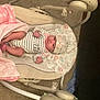 Iraheta is registered to the contest to win money with this photo: baby, infant, baby_rocker, blanket, hat, striped_clothing, carpet, cushion, newborn, indoor, person, child, resting, baby_girl, soft_toy_pattern, pink, white, cute, lying_down, comfortable